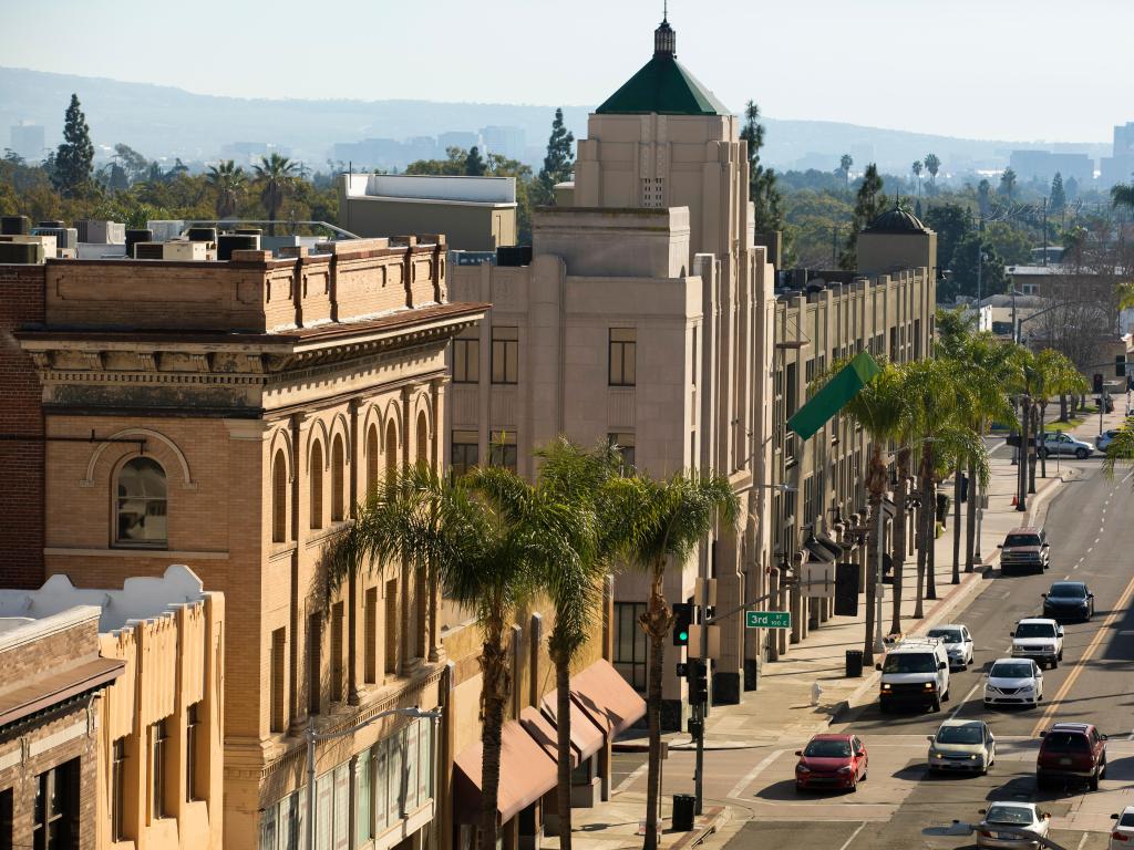 Santa Ana Historic Downtown in the sunshine with palm trees in the foreground