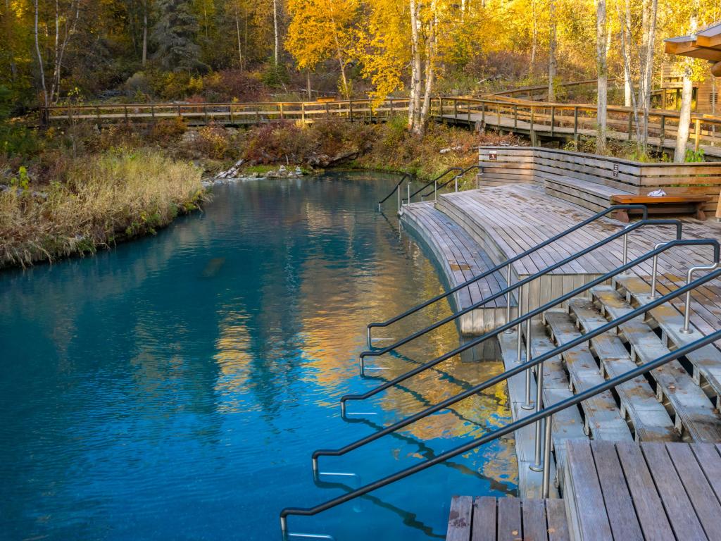 The relaxing warm waters of the Liard River Hot Springs with their wooden decking and steps down into the water.