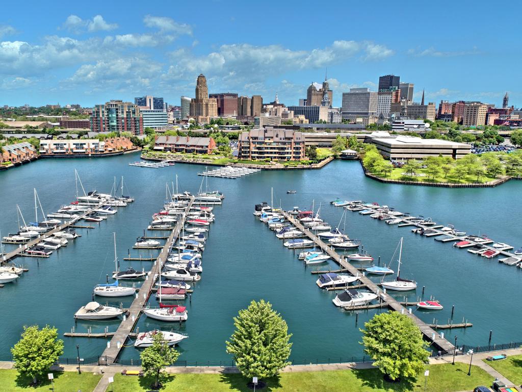 Aerial image captured in Buffalo New York, boats docked in a marina with the city's skyline in the background