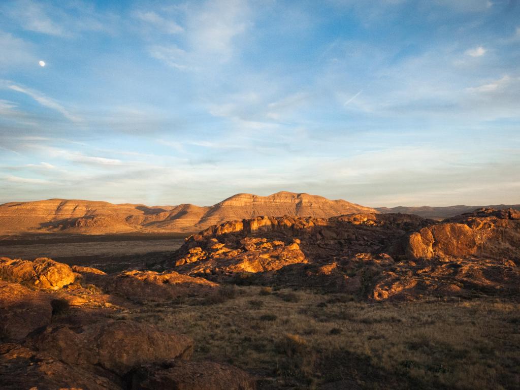 El Paso, Texas, USA with the sun setting across the mountains at Hueco Tanks.