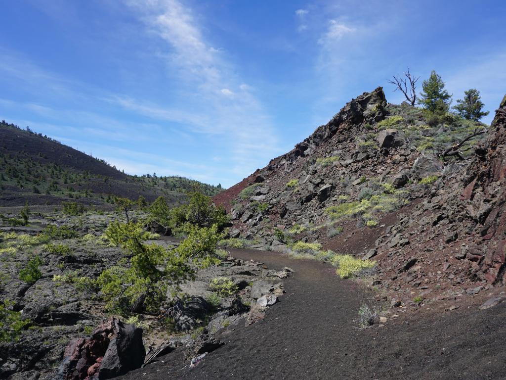 Trail in Craters of the Moon National Monument (Idaho, USA) on a sunny day.
