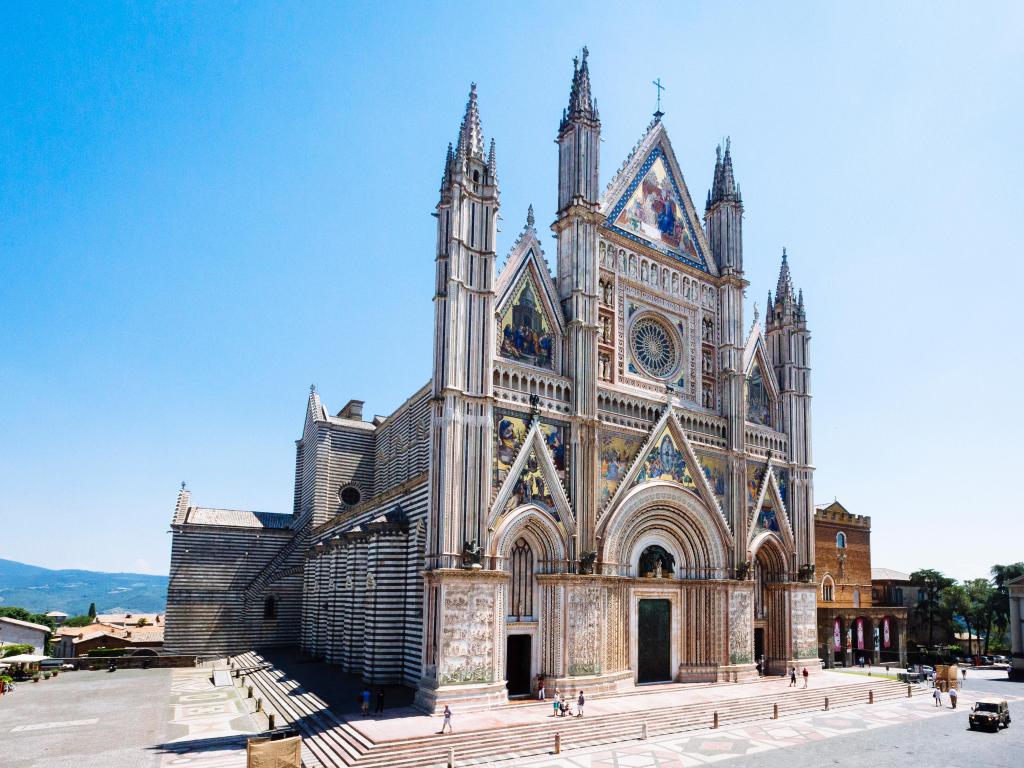 Exterior view of Orvieto Cathedral in the cathedral square, a 14th-century Gothic cathedral in Orvieto, Italy