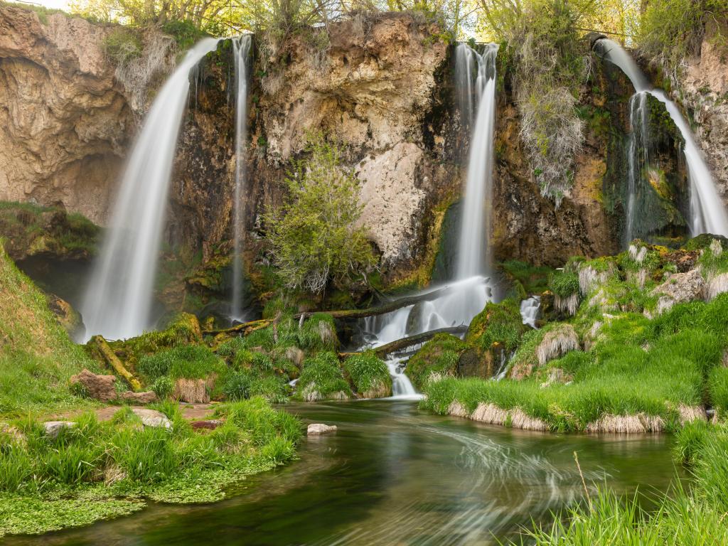 Rifle Falls State Park, Colorado, USA showing a long exposure of a triple falls at Rifle Falls in the lush Springtime.