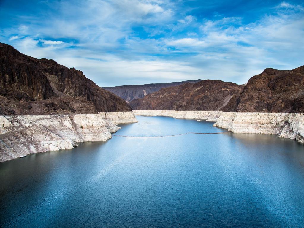 Hoover dam and Lake Mead, Las Vegas, USA with red cliffs surrounding the lake taken on a sunny day.