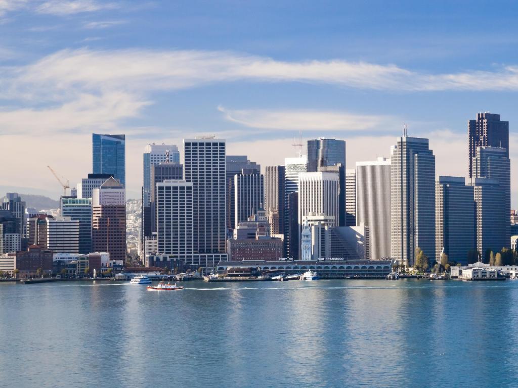 San Francisco City Downtown, California with the boats in the water in the foreground and the city in the background on a sunny day.