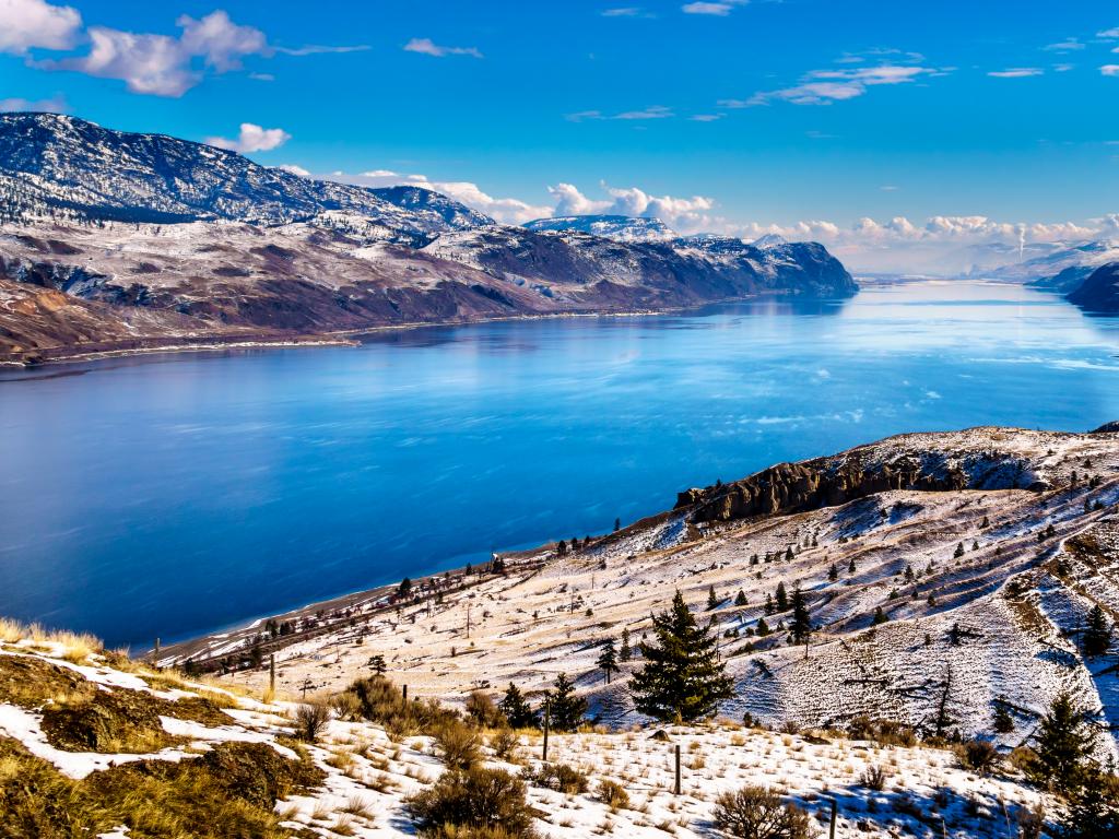 A winter view of Kamloops Lake and its surrounding mountains
