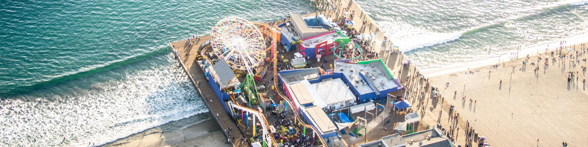Drone daytime view of busy Santa Monica Pier