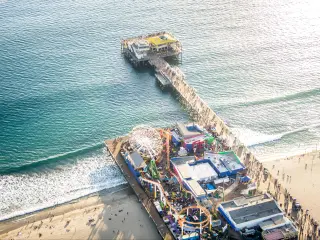 Drone daytime view of busy Santa Monica Pier