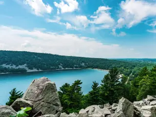Devil's Lake State Park, Wisconsin, USA taken from East Bluff trail in Devil's Lake State Park near Baraboo, overlooking the majestic view of the serene body of water and rolling hills in the Midwest.
