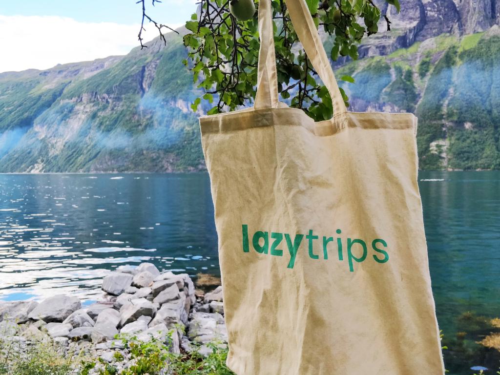 LazyTrips tote bag against the backdrop of a Norwegian fjord
