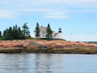 One of several lighthouses in Bar Harbor area of Maine on a mostly clear day