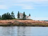 One of several lighthouses in Bar Harbor area of Maine on a mostly clear day