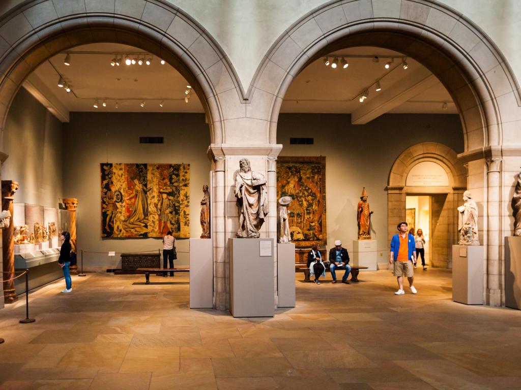 People looking at art inside The Metropolitan Museum of Art, New York