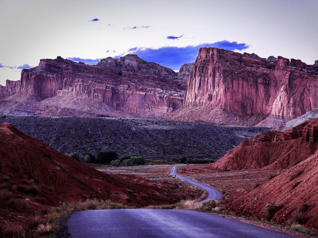 Distant view of west face of the Waterpocket Fold in Capitol Reef National Park photographed from the parks scenic drive at dusk