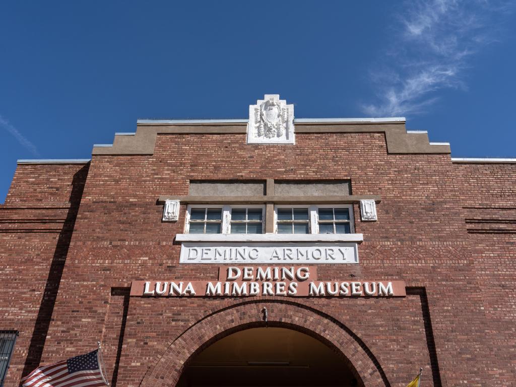 The front exterior of the brick building that houses the museum on a sunny day