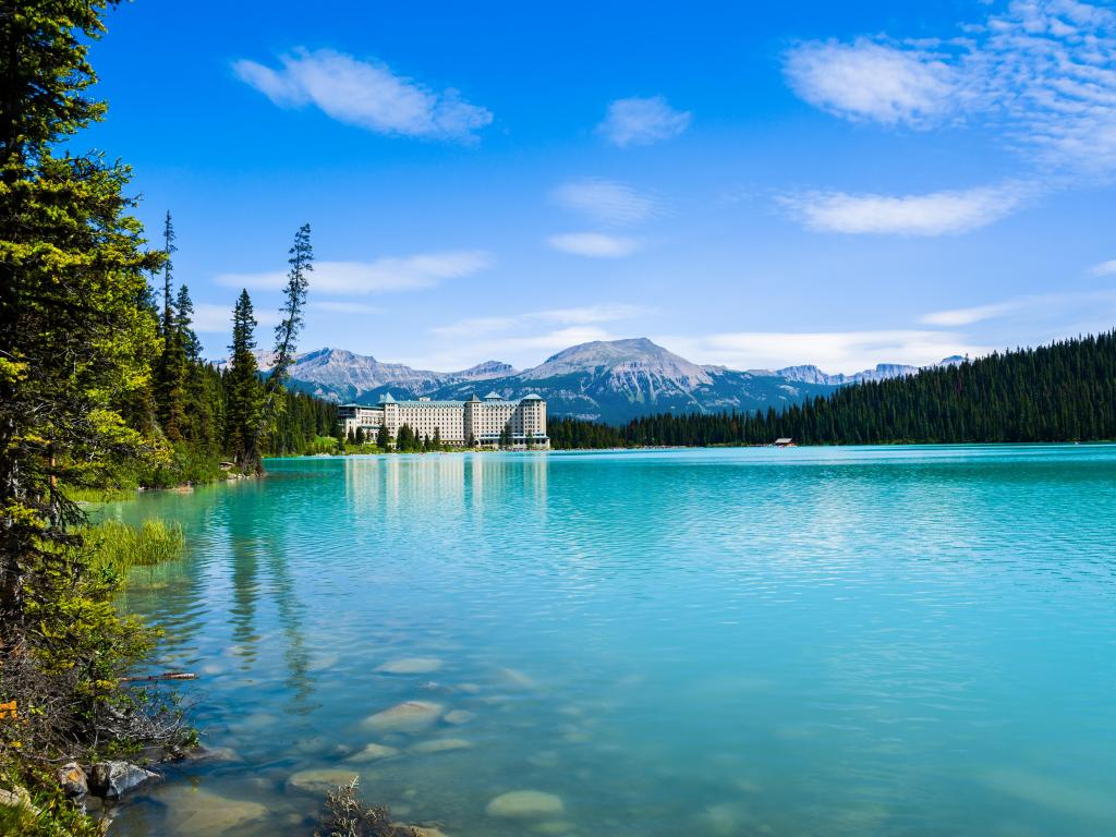 The turquoise waters of Lake Louise with the majestic Fairmont Chateau Hotel in the background.