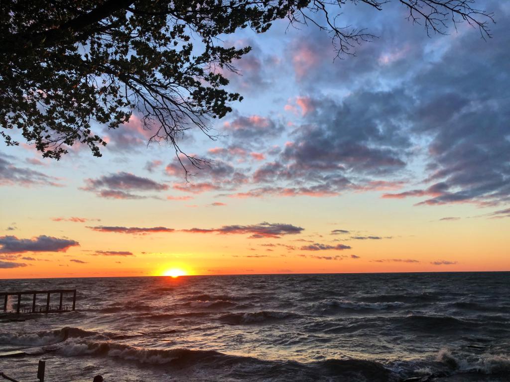 A sunset over the wavy waters of Lake Erie