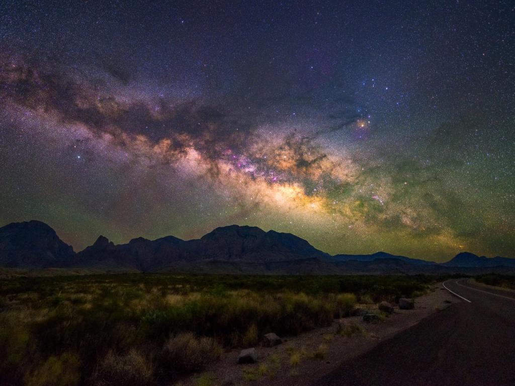 The clear night sky with the Milky Way visible from Big Bend National Park at the side of the road in Texas