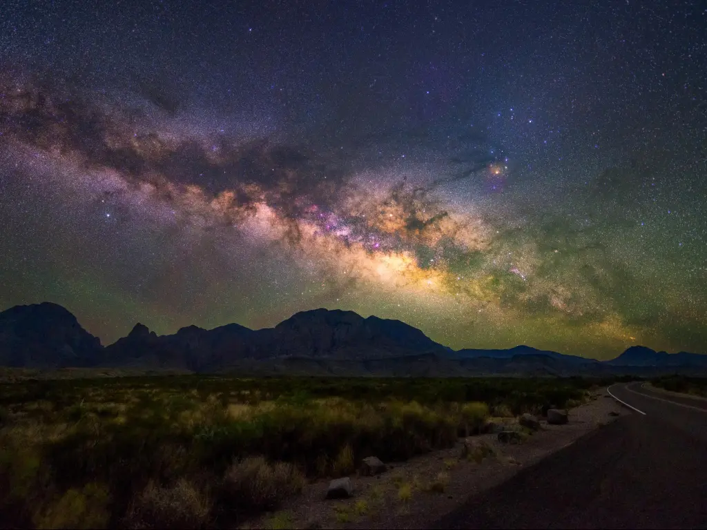 The clear night sky with the Milky Way visible from Big Bend National Park at the side of the road in Texas