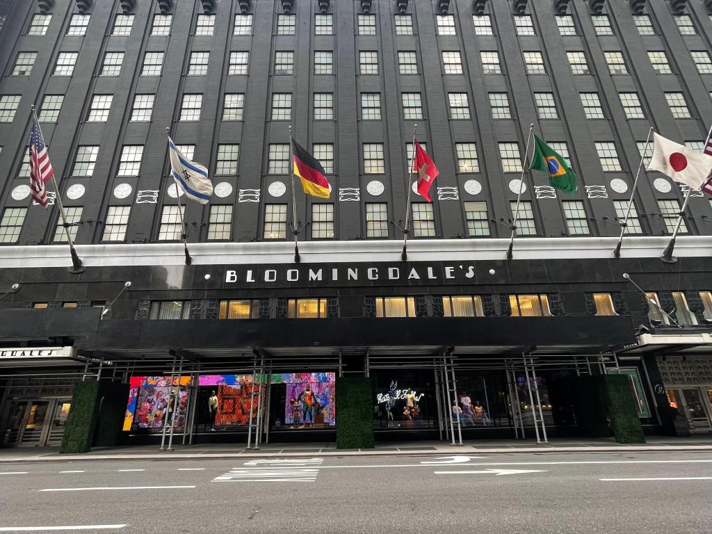 Front entrance to Bloomingdales Department Store in Upper East Side with flags lined up over the famous doorway