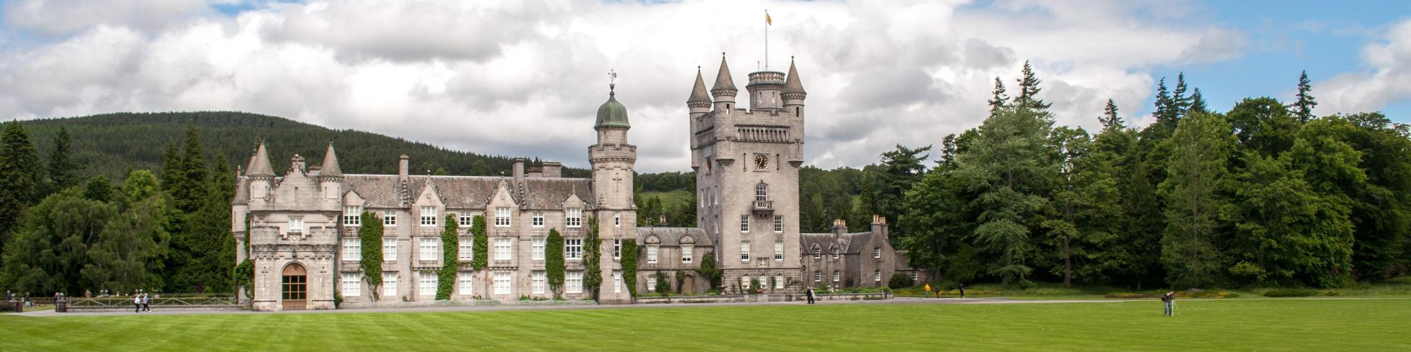 View of the Royal Balmoral Castle and lush green grounds and landscape, Scotland
