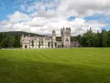 View of the Royal Balmoral Castle and lush green grounds and landscape, Scotland