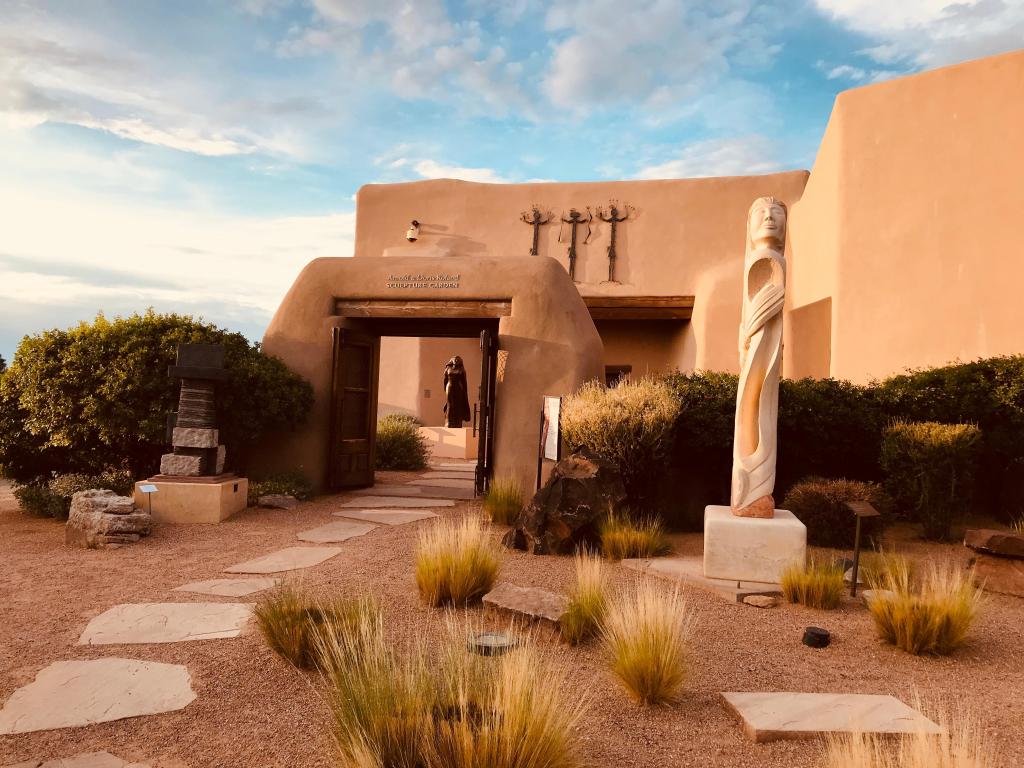 Historic building of the museum and the entrance to the Sculpture Garden as the sun sets