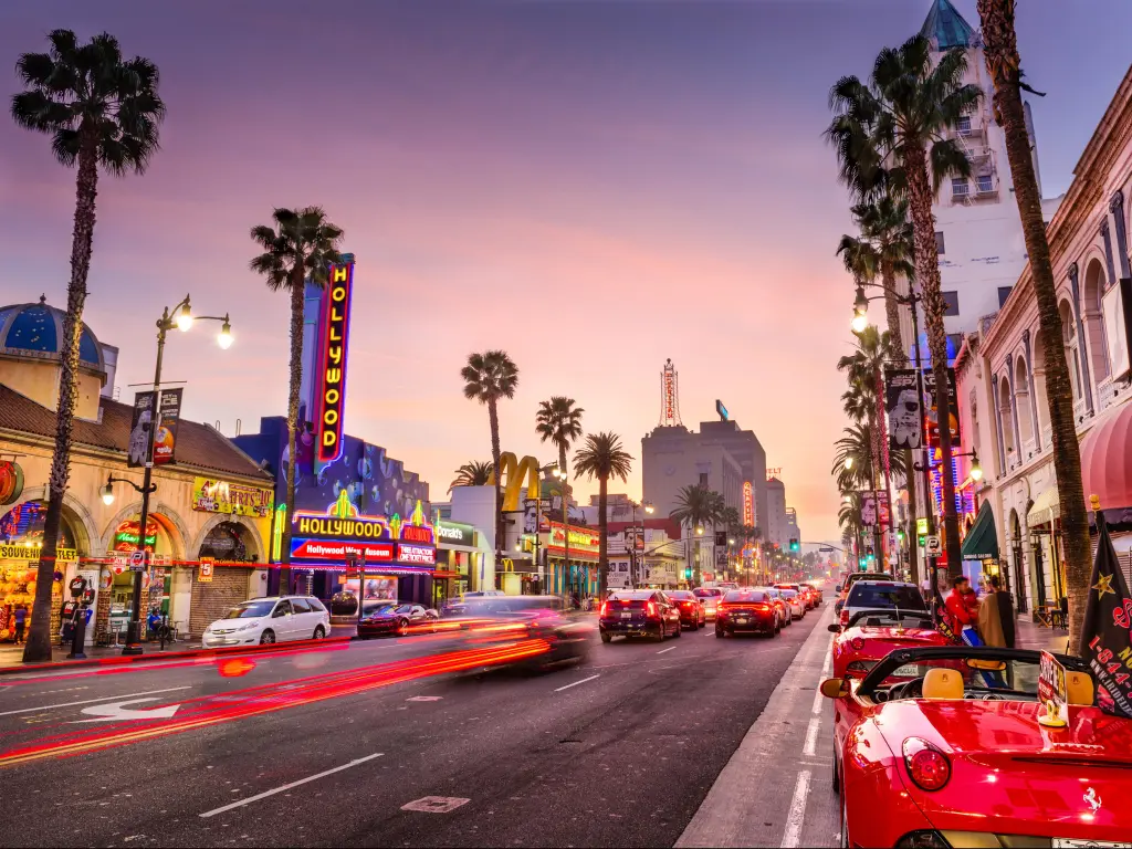 Traffic on Hollywood Boulevard at dusk. The theater district is famous tourist attraction.