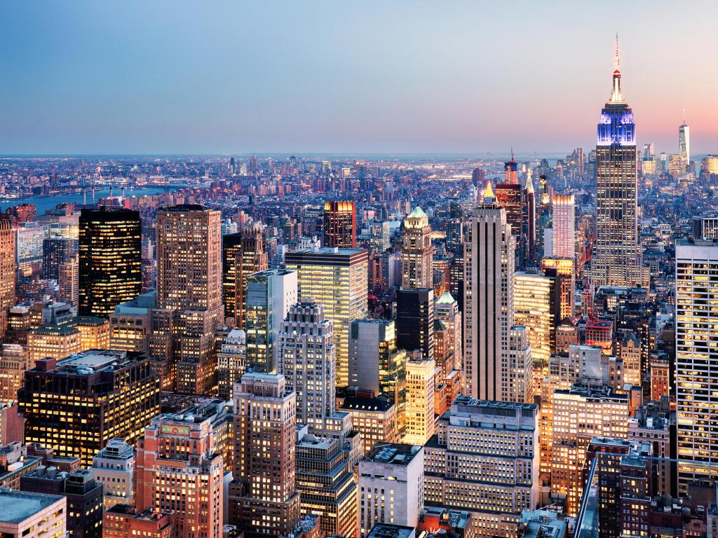 New York City, USA with a view of the skyline at sunset.