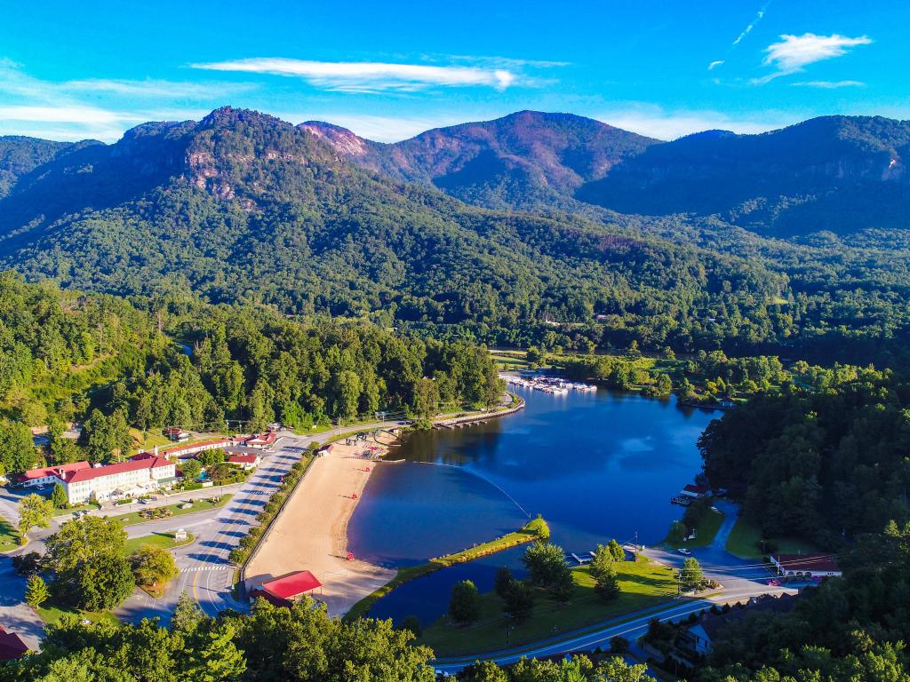 Aerial photo of Lake Lure, with its beach and surrounding mountains and trees