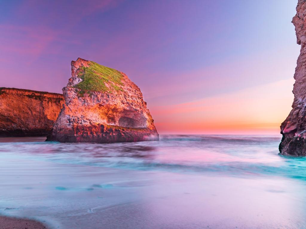 Santa Cruz, California, USA taken at Shark Fin Cove at sunset with a calm sea. 