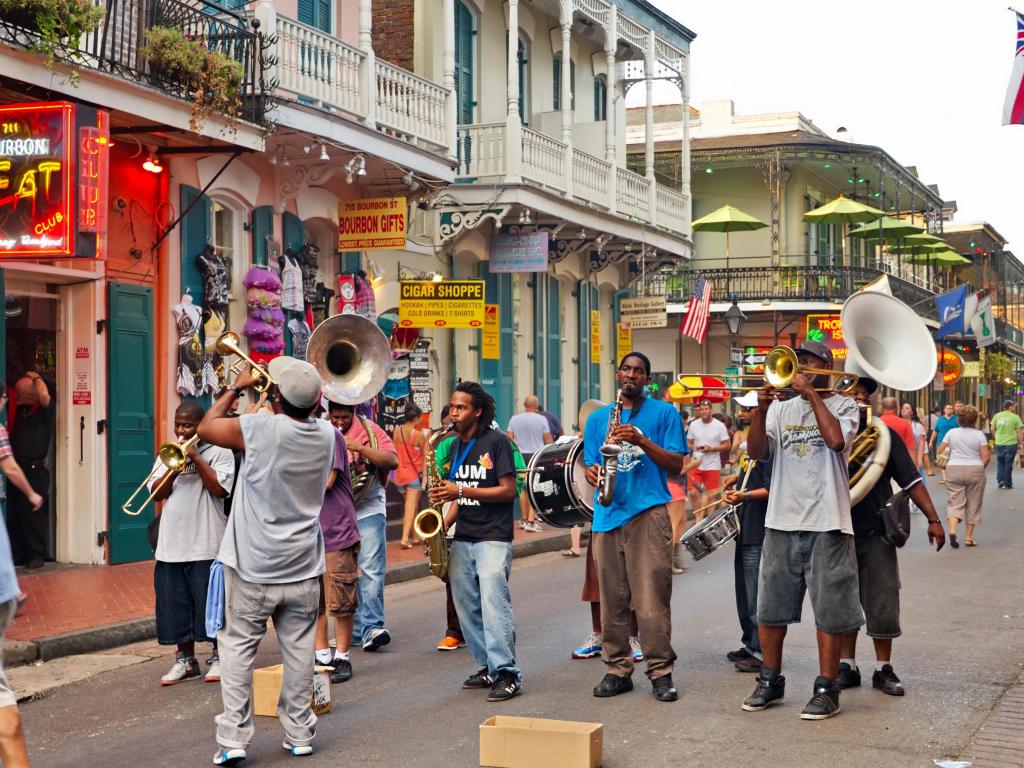 A jazz band playing in New Orleans' famous Bourbon Street on a summer evening.