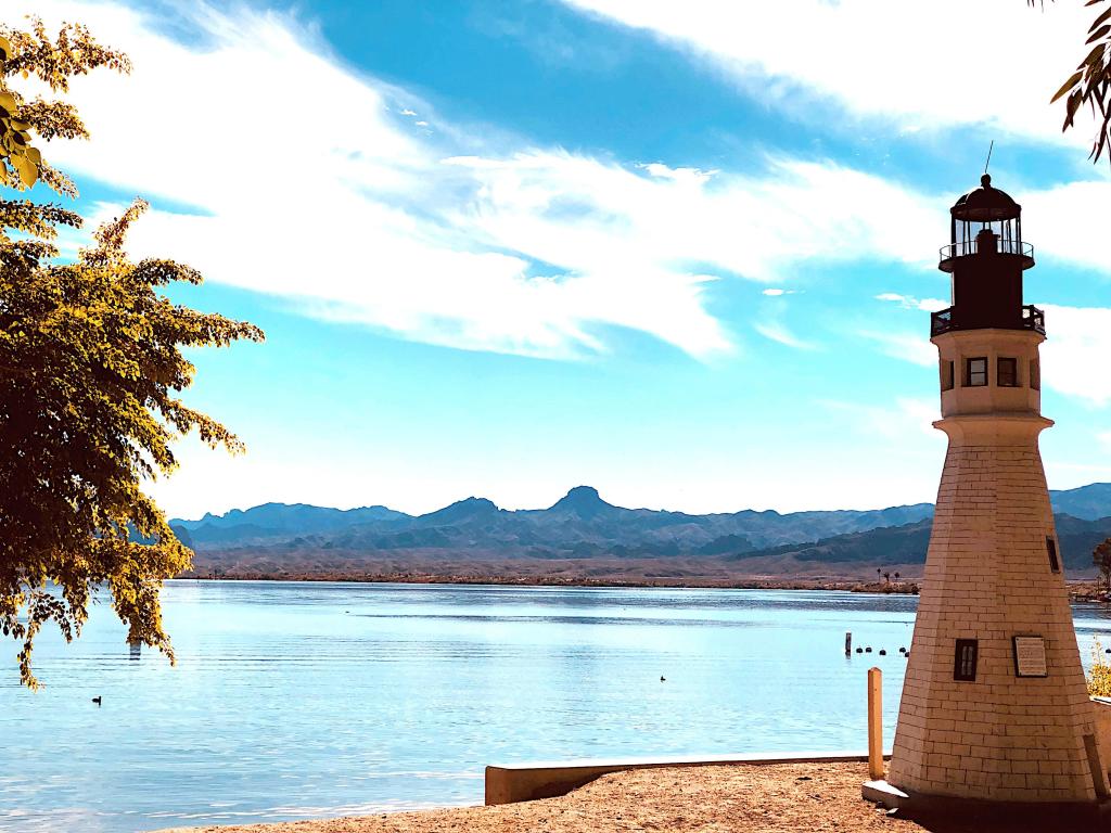 Lighthouse on the banks of Lake Havasu, Arizona, with mountains in the background