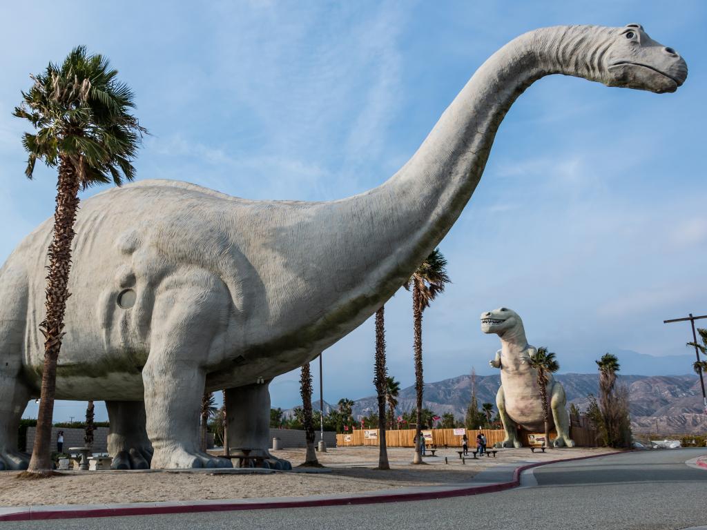 Large dinosaur sculptures standing near Highway 10 in Cabazon, California