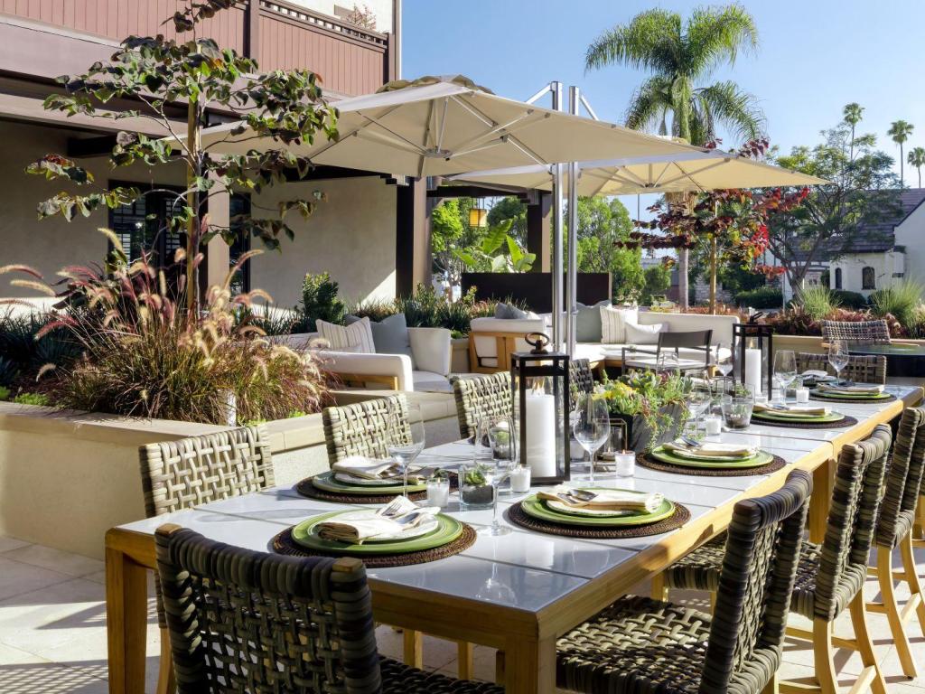 Outdoor dining area in the sunshine at Ambrose Hotel, Los Angeles