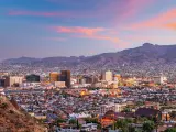El Paso, Texas, USA with the downtown city skyline at dusk with Juarez, Mexico in the distance.