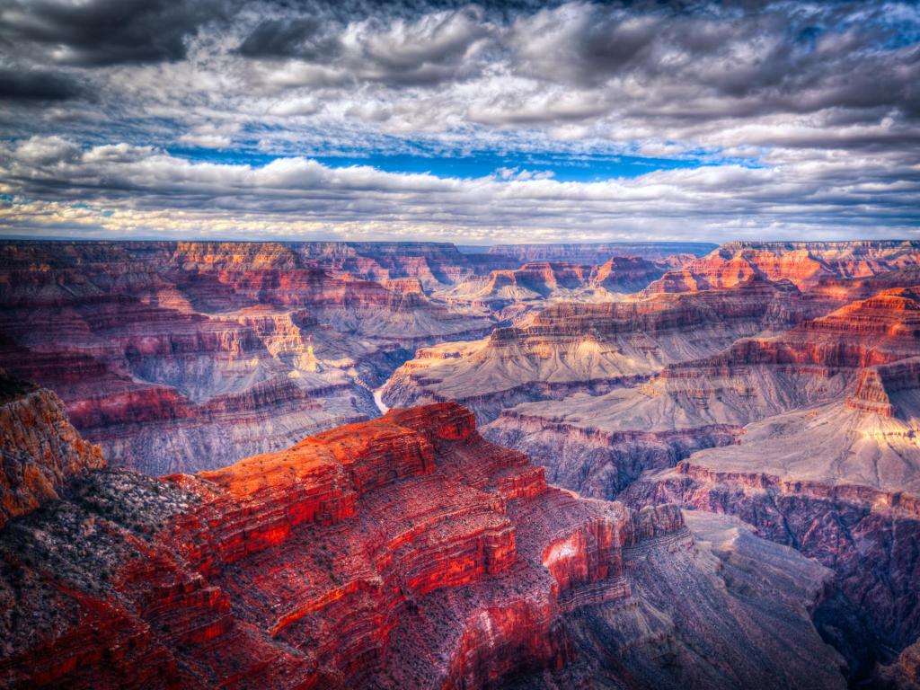 Famous view of Grand Canyon, Arizona, USA against a cloudy sky.