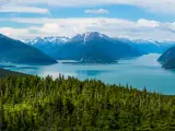 Haines, Alaska surrounded by snow-capped mountains and ocean inlets on a summer day.