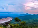 View over forested mountains and valleys from a high vantage point