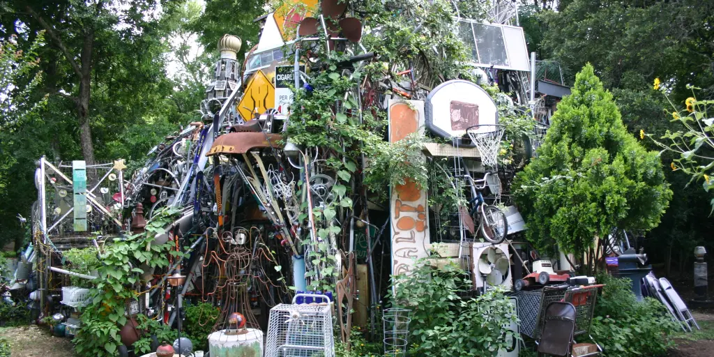 Cathedral of Junk, Austin with leaves growing on the outside 