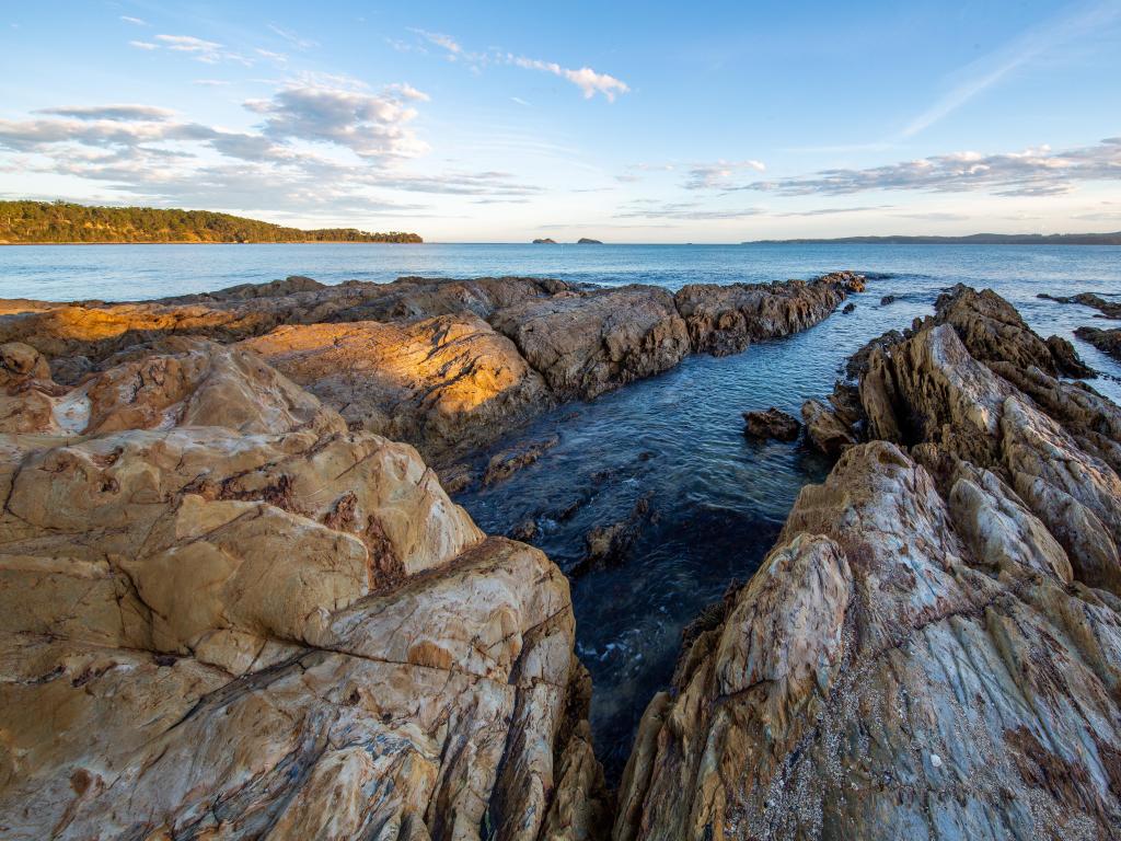 Bateman's Bay, NSW, Australia with a wide Angle Shot of Rocky Beach Coastline looking out to the ocean at Bateman's Bay.