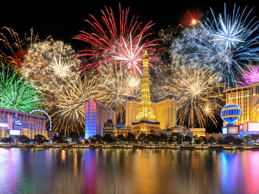 High rise buildings at night with spectacular fireworks behind