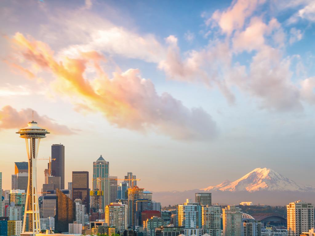 A panoramic view of downtown Seattle Skyline and the mountain at sunset on a fine day in Seattle, WA.