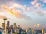 A panoramic view of downtown Seattle Skyline and the mountain at sunset on a fine day in Seattle, WA.