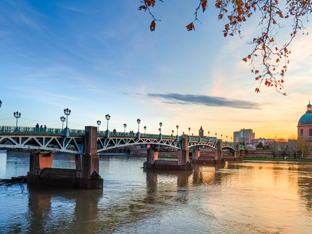 Garonne river and Dome de la Grave in Toulouse, France at sunset.