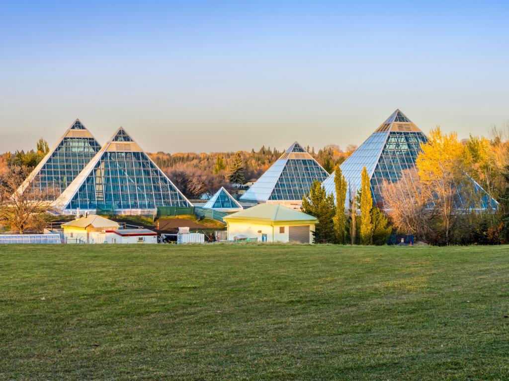 Glass pyramids of the conservatory during sunset