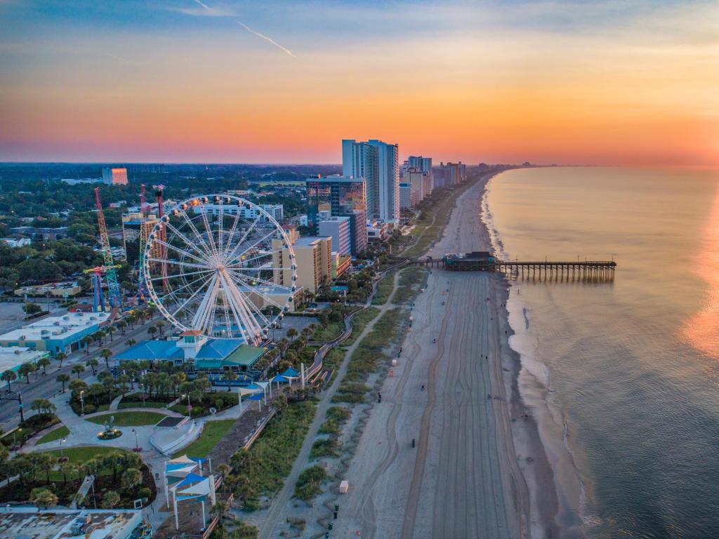 Aerial photo of Myrtle Beach, SC at sunset, with ferris wheel in the foreground