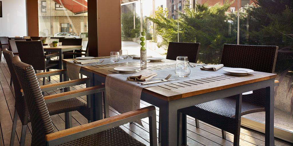 Terrace breakfast area at the Hotel Ciudad Gijon looking outside