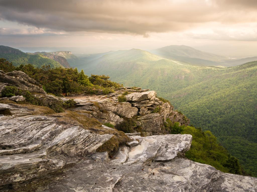 Sunsire atop Hawksbill Mountain, gazing southward into Linville Gorge, with Table Rock Mountain visible in the far distance.