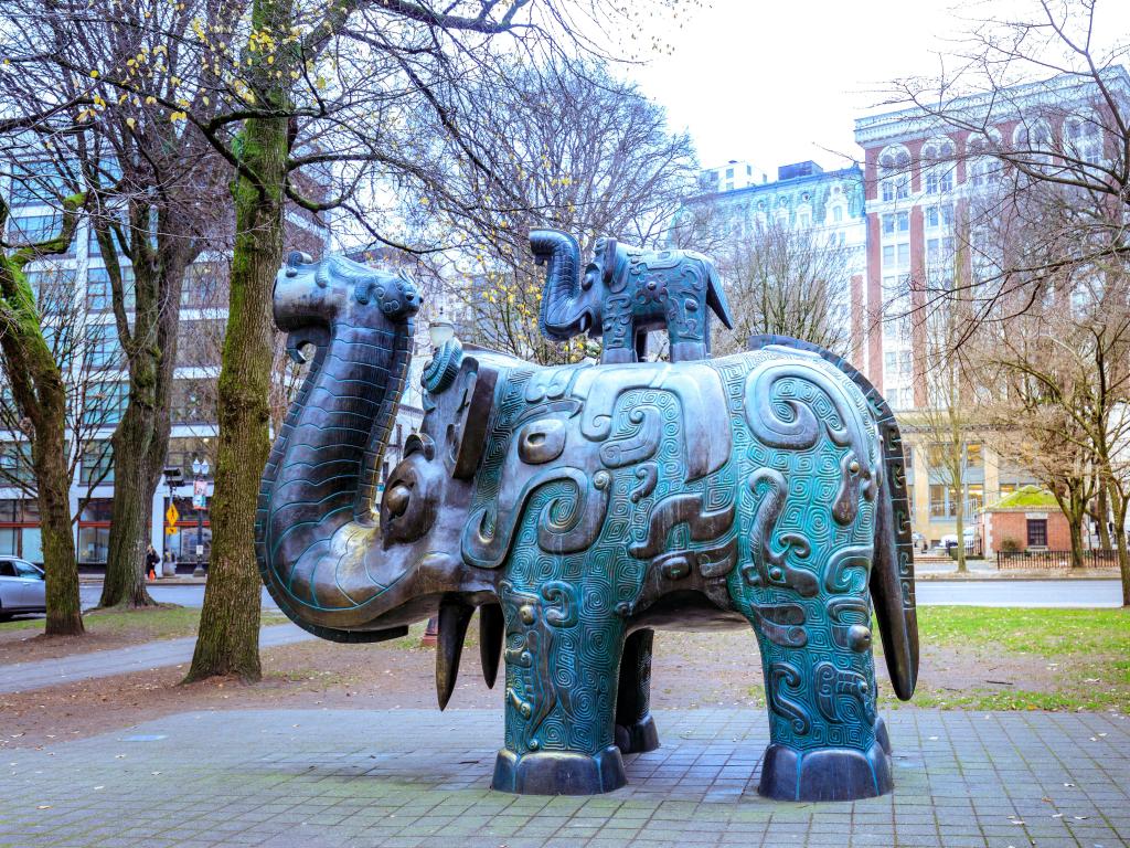 Close up of grey and green aging elephant statues in Pearl District, Old Town Chinatown, Portland